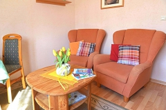 Das gemütliche Wohnzimmer lädt zum Relaxen ein.